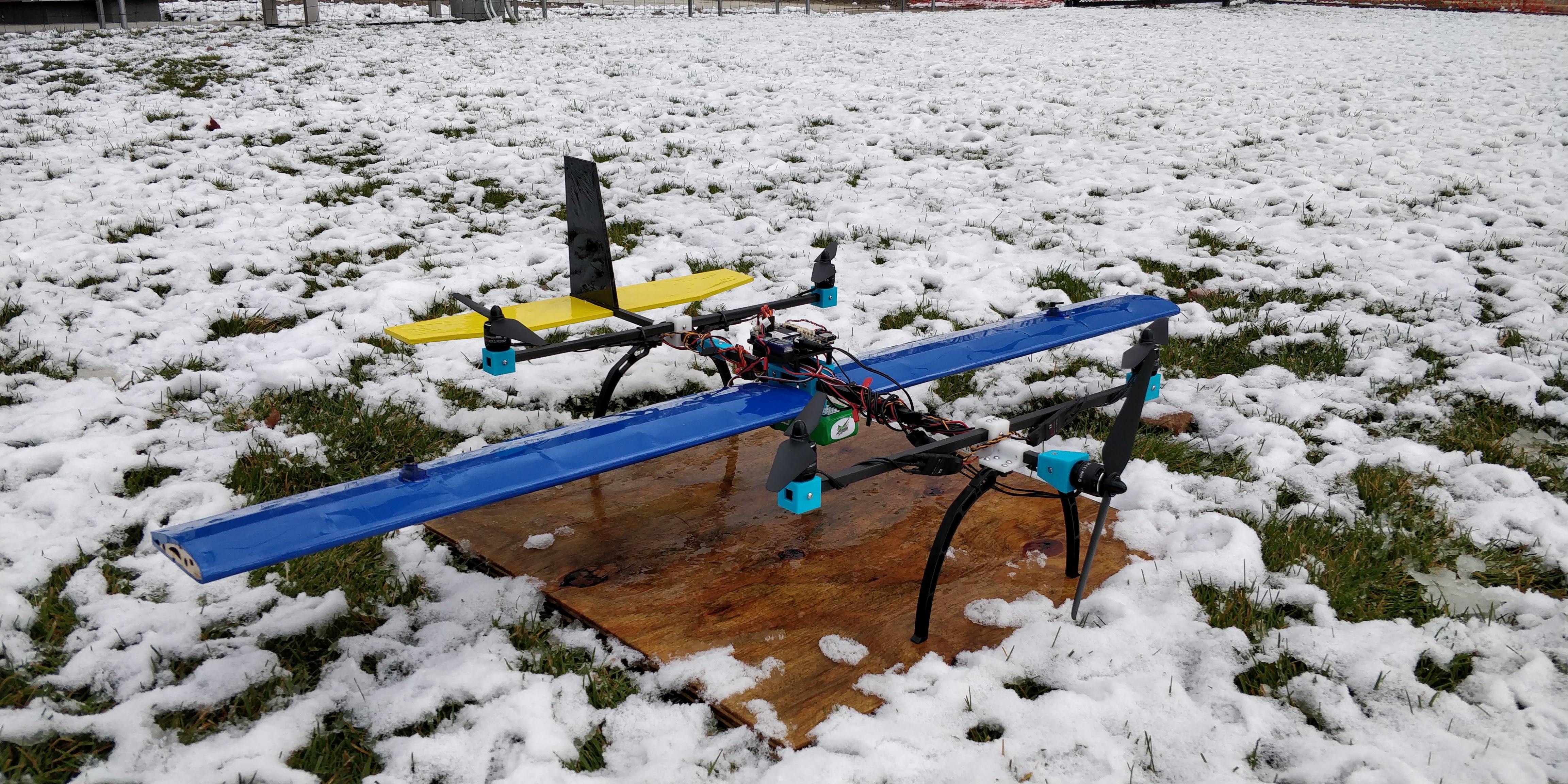 quadplane on wood on snowy grass